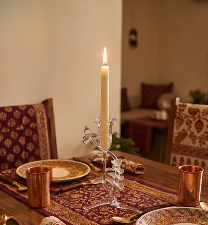 Floral glass candle holder on dining table